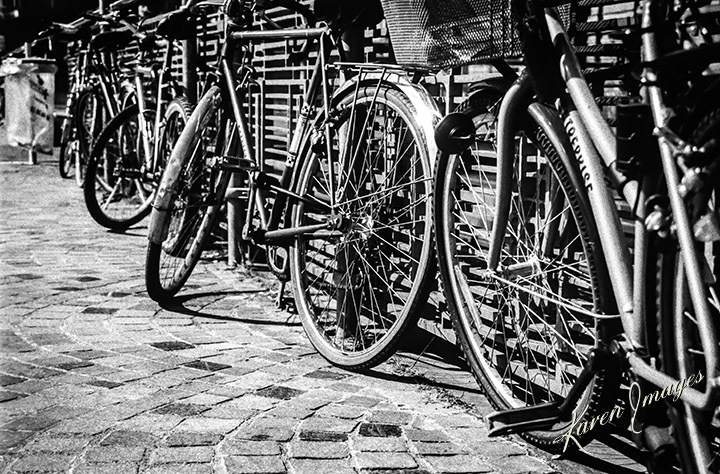 A black and white image of fine art photography of bicycles in Paris France photographed by Atlanta Fine Art Photographer Karen Images