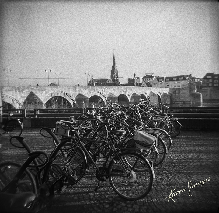 A black and white image of fine art photography of bicycles in Maastricht Netherlands photographed by Atlanta Fine Art Photographer Karen Images