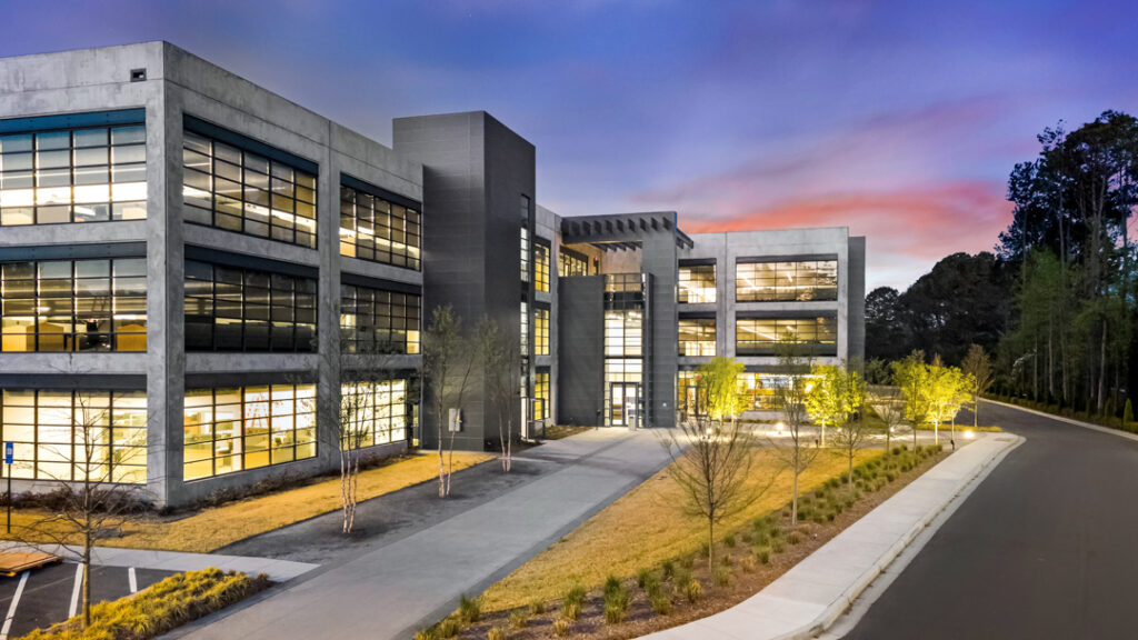 Architectural twilight photograph of the exterior of Vanderlande Corporate Office in Kennesaw, Georgia by Atlanta Architectural photographer Karen Images
