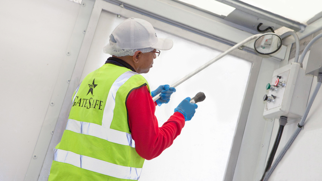 corporate marketing_advertising_commercial_ads_karen images 2023 - 029 - atlanta's commercial photographer stock photography of a gate safe employee inspecting equipment by commercial photographer karen images