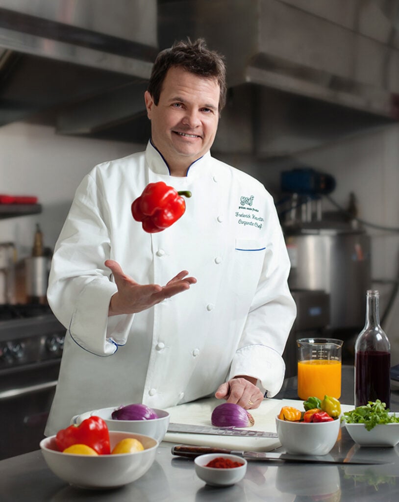 Image of an executive chef catching a red pepper in a test kitchen in Atlanta, GA by Atlanta Commercial Photographer Karen Images