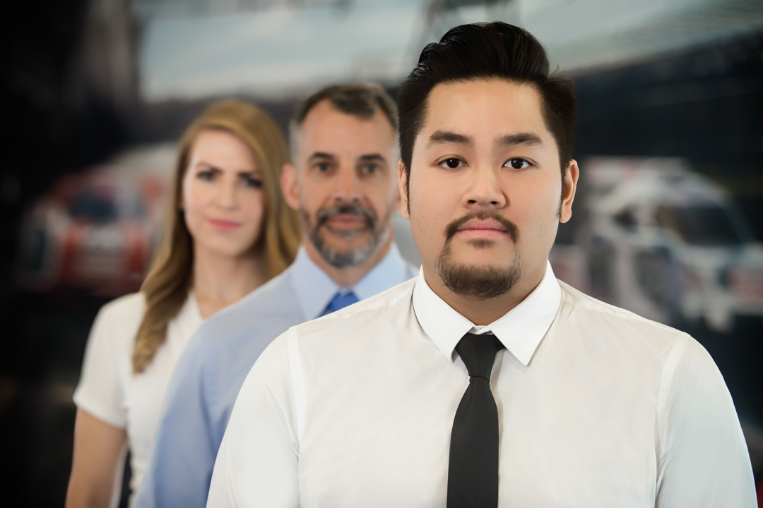 Porsche employees collaborating in a corporate workplace environment