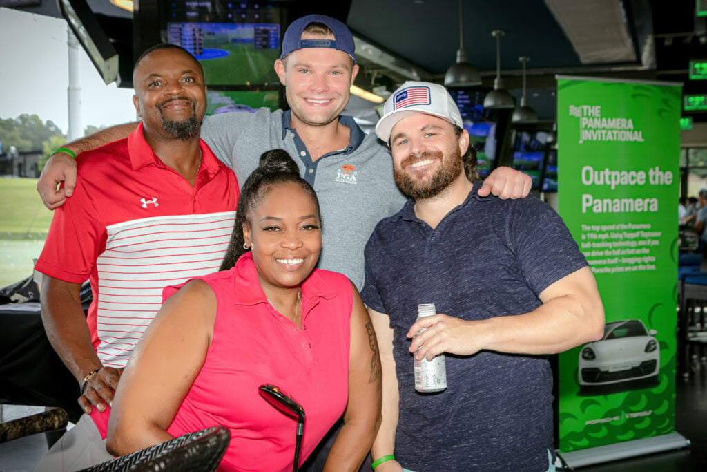 An image of four contestants at a Top Golf corporate event hosted by Porsche photographed by Atlanta Corporate Event Photographer Karen Images