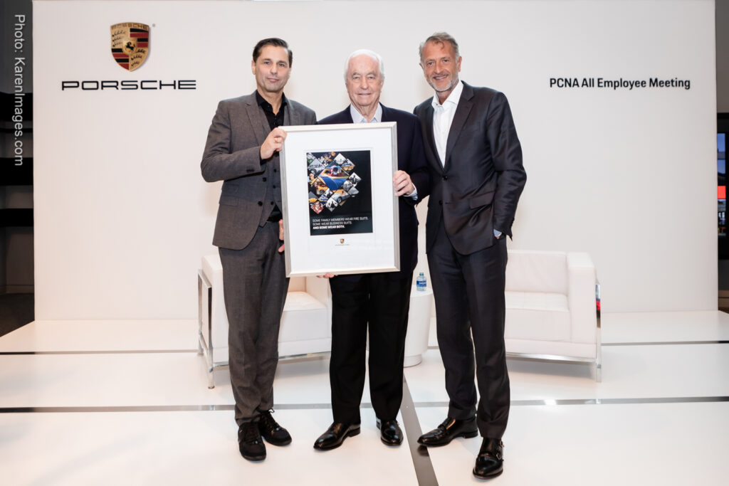 An image of an award presentation at an event at One Porsche Drive photographed by Atlanta Corporate Event Photographer Karen Images