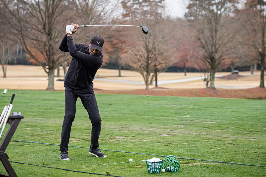 An image of a golfer on a driving range at a corporate event photographed by Atlanta Corporate Event Photographer Karen Images