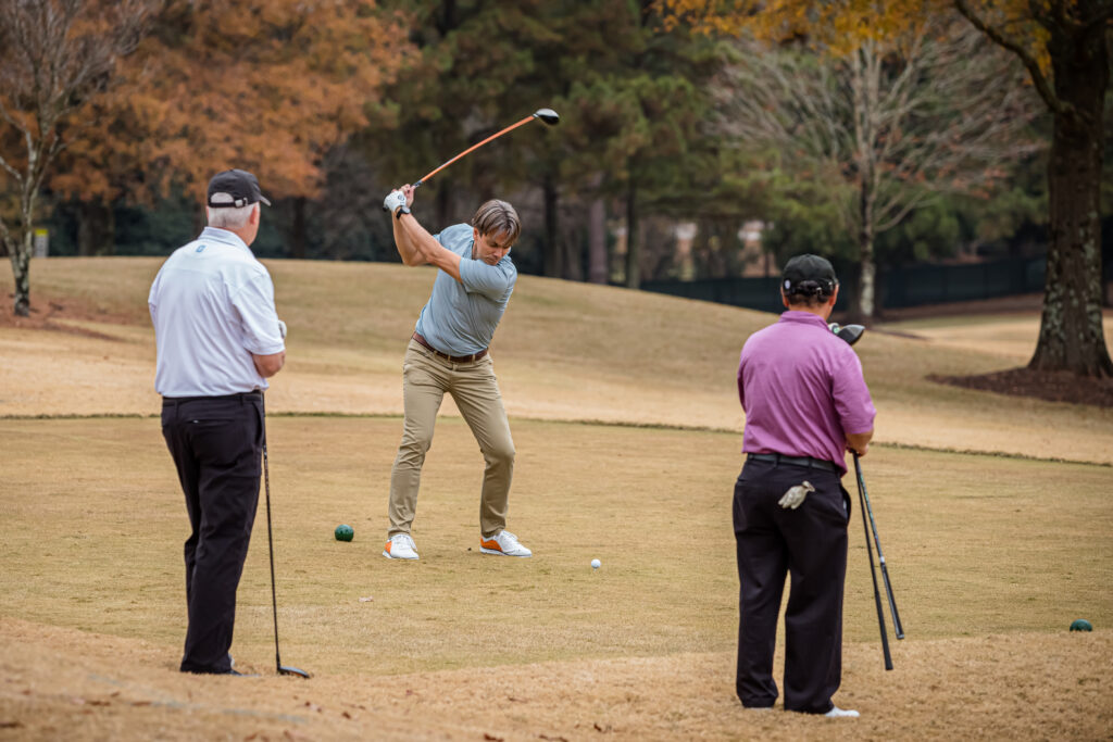 An image of golfers playing golf at a corporate event photographed by Atlanta Corporate Event Photographer Karen Images