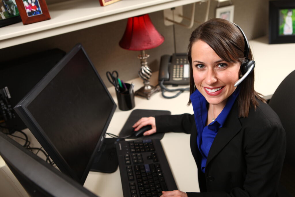 custom corporate stock photography 02 - atlanta's commercial photographer an custom stock image image of a receptionist at a desk photographed by atlanta corporate stock photographer karen images
