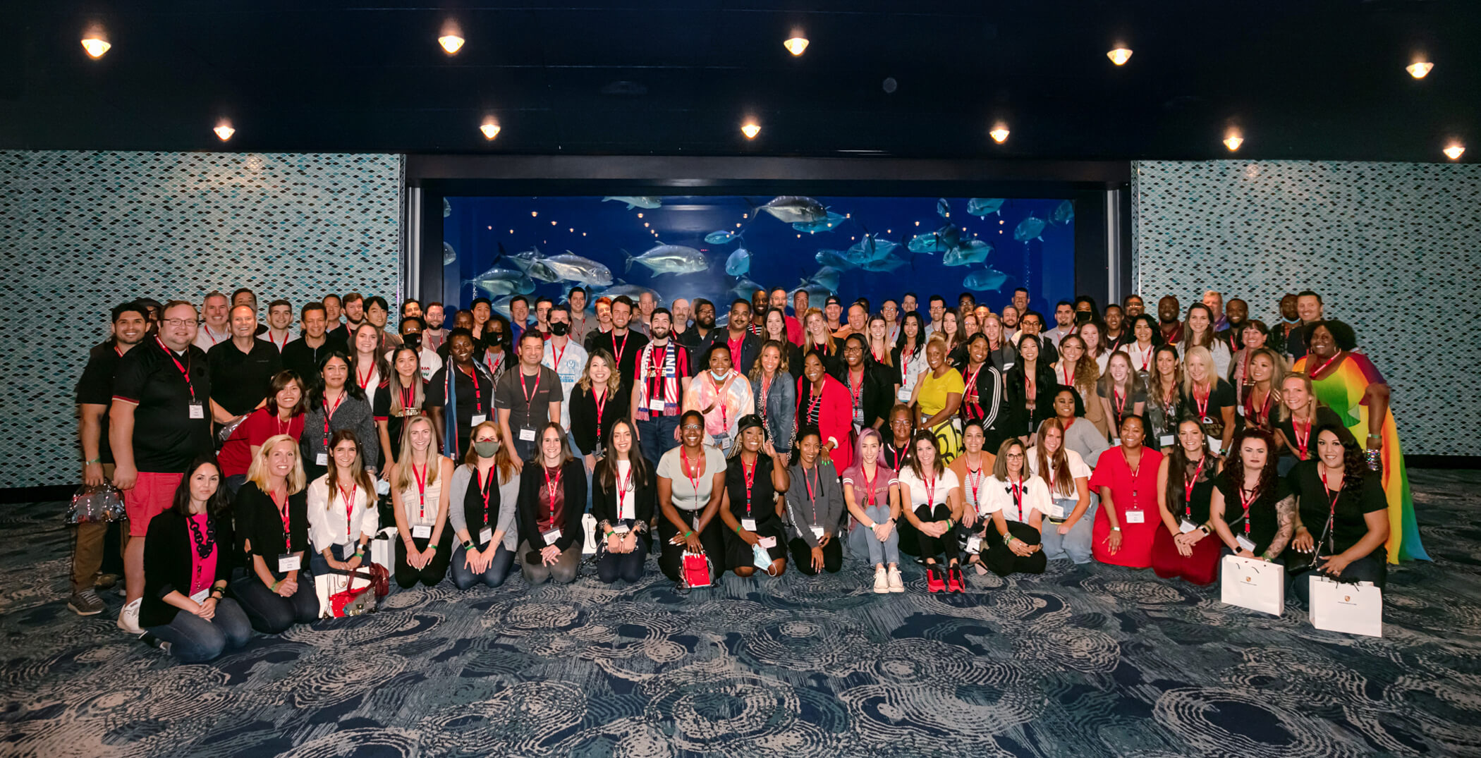 All Team Photograph of Porsche Financial Services gathered at Georgia Aquarium for a corporate event group photograph