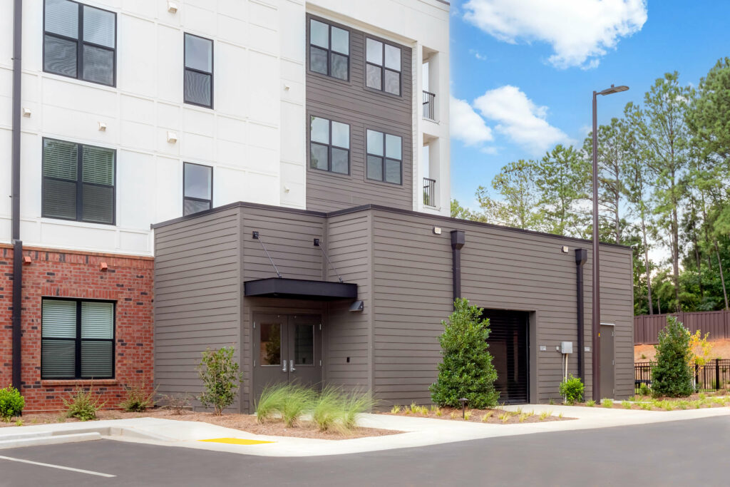 an exterior of the veranda at assembly photographed a kitchen in a one bedroom model home at crofthouse photographed by architectural photographer karen images