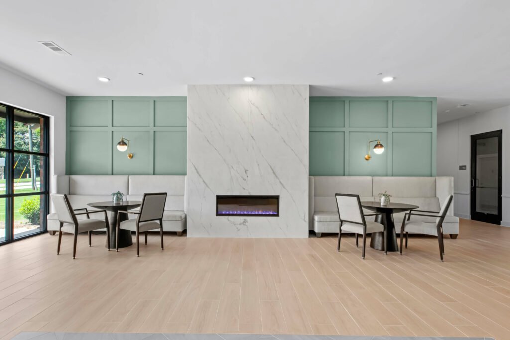 cafe tables at the veranda at assembly a kitchen in a one bedroom model home at crofthouse photographed by architectural photographer karen images