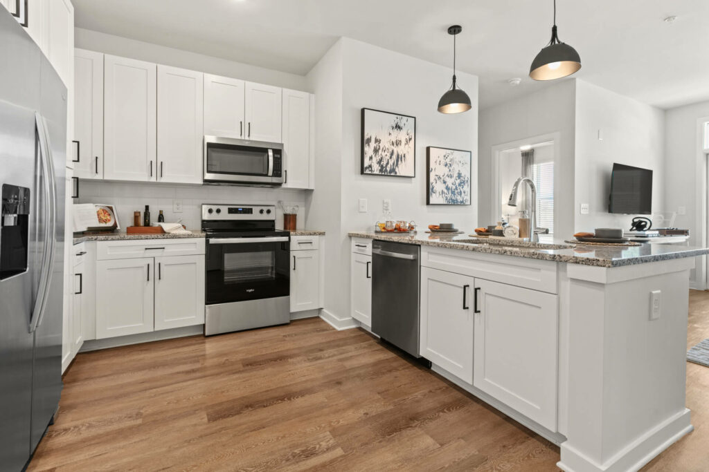 a kitchen in a one bedroom model home at crofthouse photographed by architectural photographer karen images