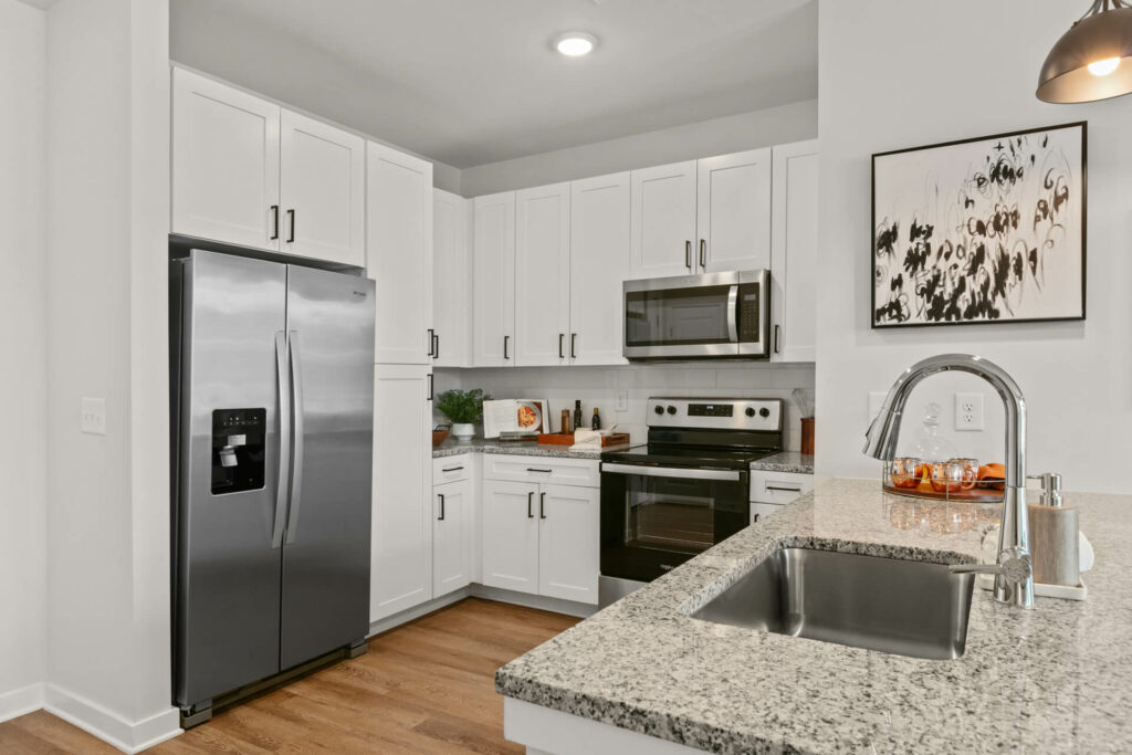 alternate view of kitchen in a one bedroom model home at crofthouse photographed by architectural photographer karen images