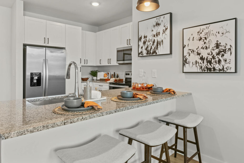 breakfast bar in a kitchen in a one bedroom model home at crofthouse photographed by architectural photographer karen images