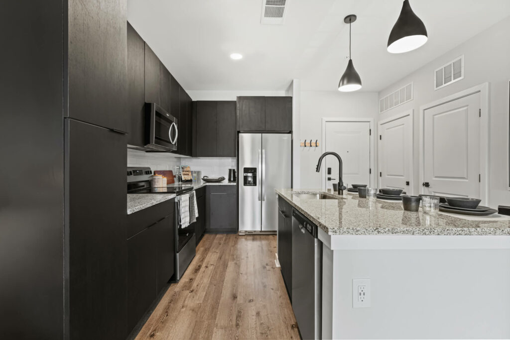 full view of a kitchen in a one bedroom apartment at oslo by architectural photographer karen images