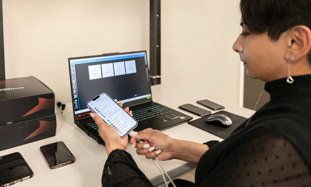 An associate checks in a mobile device for data recovery ar S2 Data by Karen Images