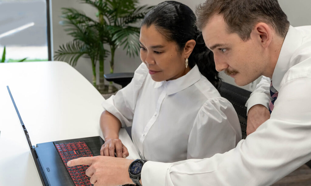 Employees troubleshooting data for S2 Data by Karen Images