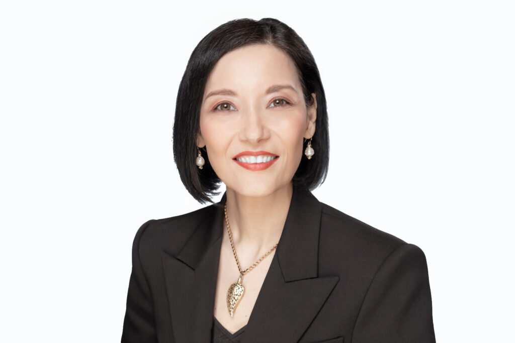 an example of a corporate headshot taken to comply with corporate branding guidelines on a white background