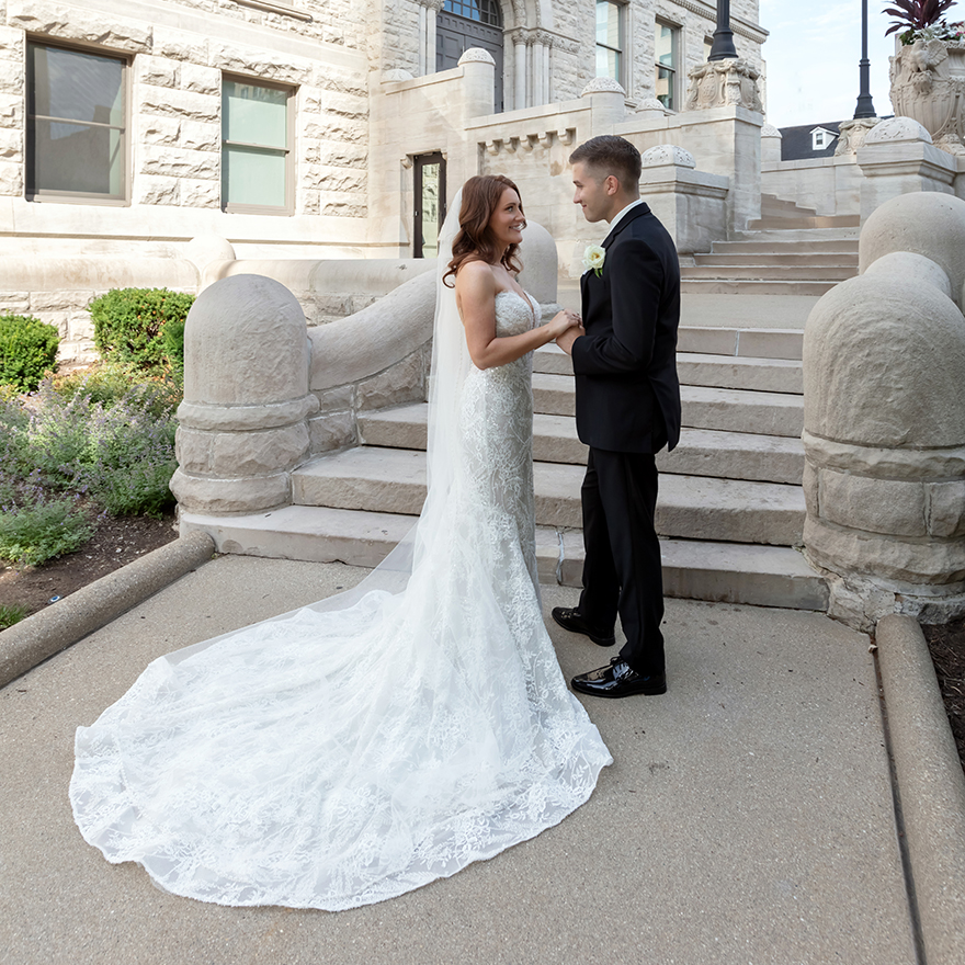 Bride and groom together on the steps during their Lexington KY wedding photographed by Karen Images