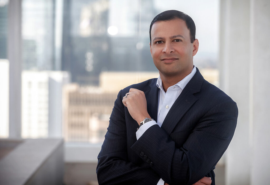 Corporate headshot of a man in his office in a corporate lifestyle headshot image