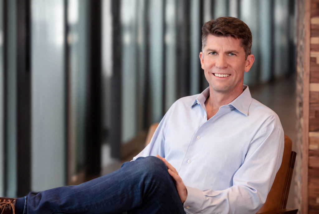 man seated in atlanta tech village - corporate lifestyle headshot