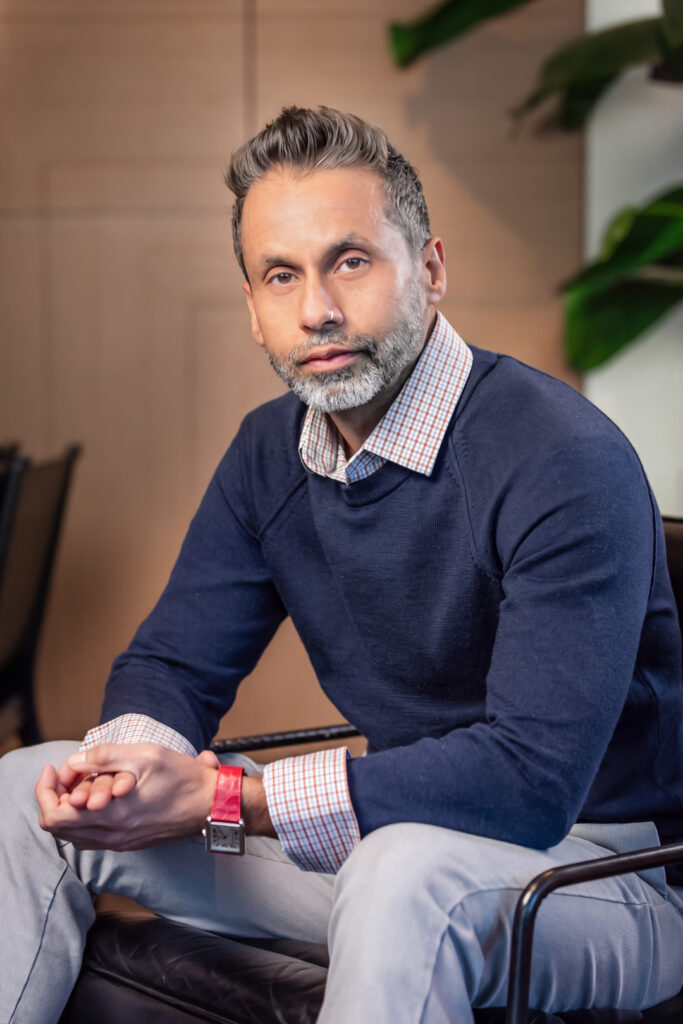environmental headshot of a man in a hotel lobby